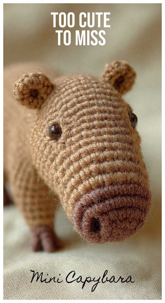 tiny crochet capybara amigurumi in hand cute handmade capybara toy cozy setting