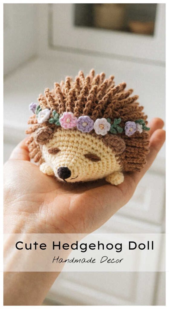 Small hedgehog amigurumi with flower crown in hand, adorable handmade crochet toy for cozy gifts