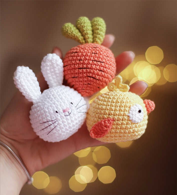 small crochet bunny chick and carrot amigurumi held in hand cute handmade easter toy set