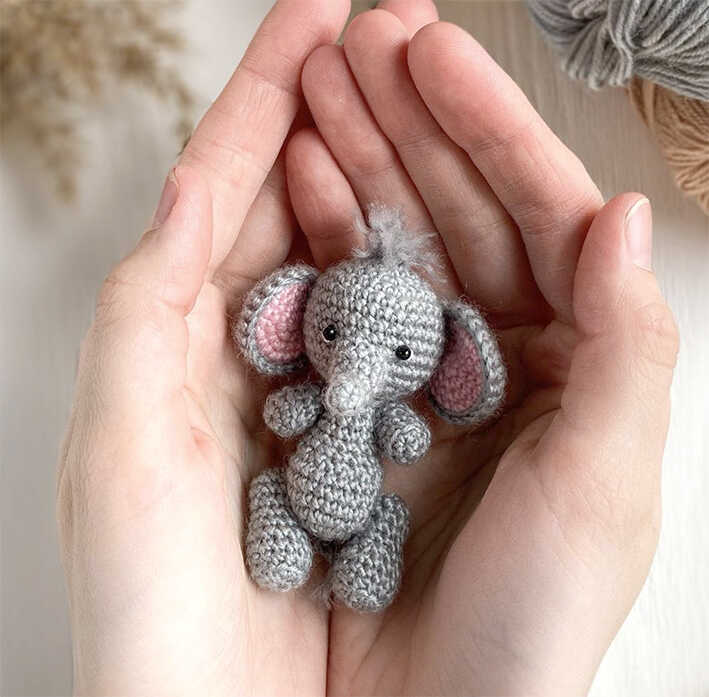 tiny crochet elephant amigurumi in hands free crochet pattern small handmade elephant keychain toy