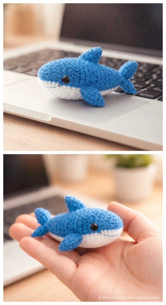 small blue crochet shark amigurumi on a laptop and in hand showing tiny ocean animal crochet toy size