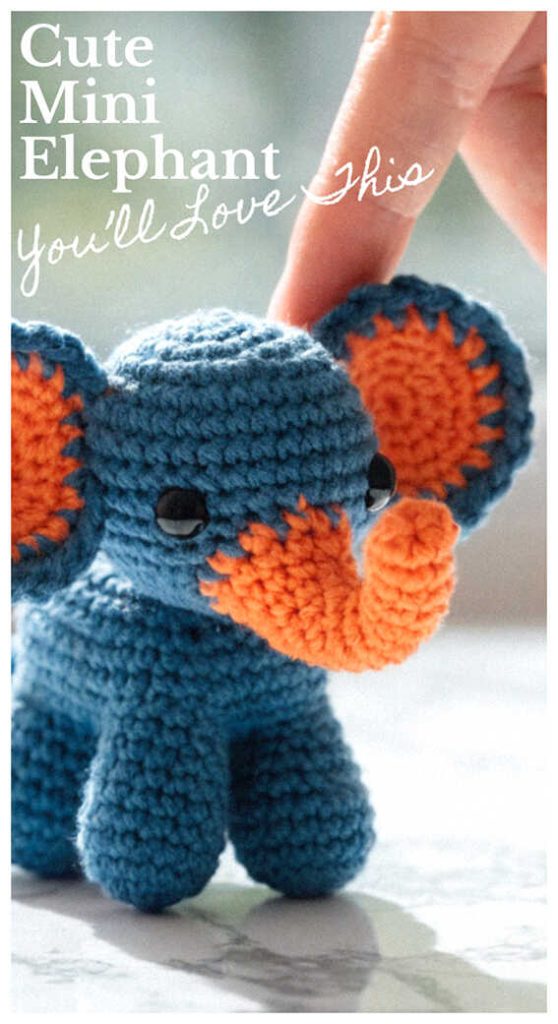 mini crochet elephant amigurumi in blue and orange cute handmade elephant toy held in hand