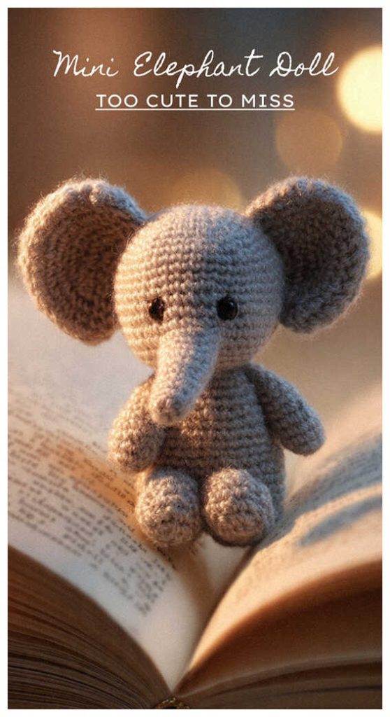 small crochet elephant amigurumi sitting on a book cute handmade elephant doll cozy setting