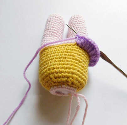 Crochet pig doll body with skirt in progress, amigurumi pig skirt detail step