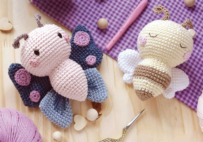 crochet butterfly and bee amigurumi flat lay free crochet pattern cute handmade insect toys on crafting table