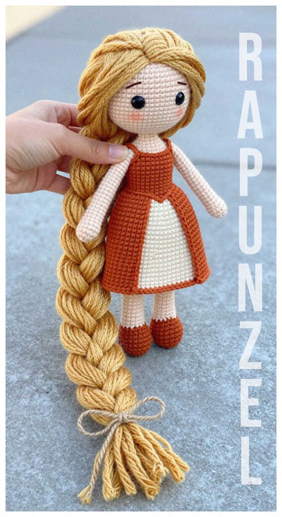 crochet rapunzel doll in hand long braid cute handmade toy idea