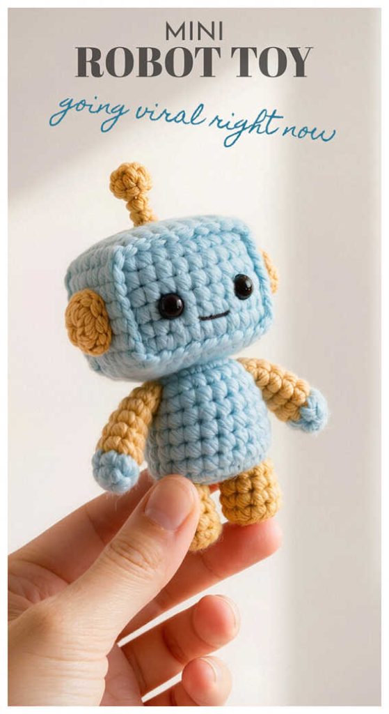 tiny crochet robot amigurumi held in hand cute handmade robot toy free pattern inspiration
