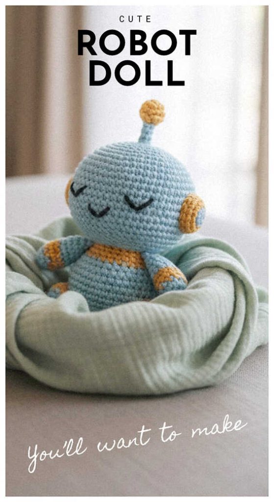 crochet robot doll in soft bed cute handmade robot toy free pattern inspiration cozy setting