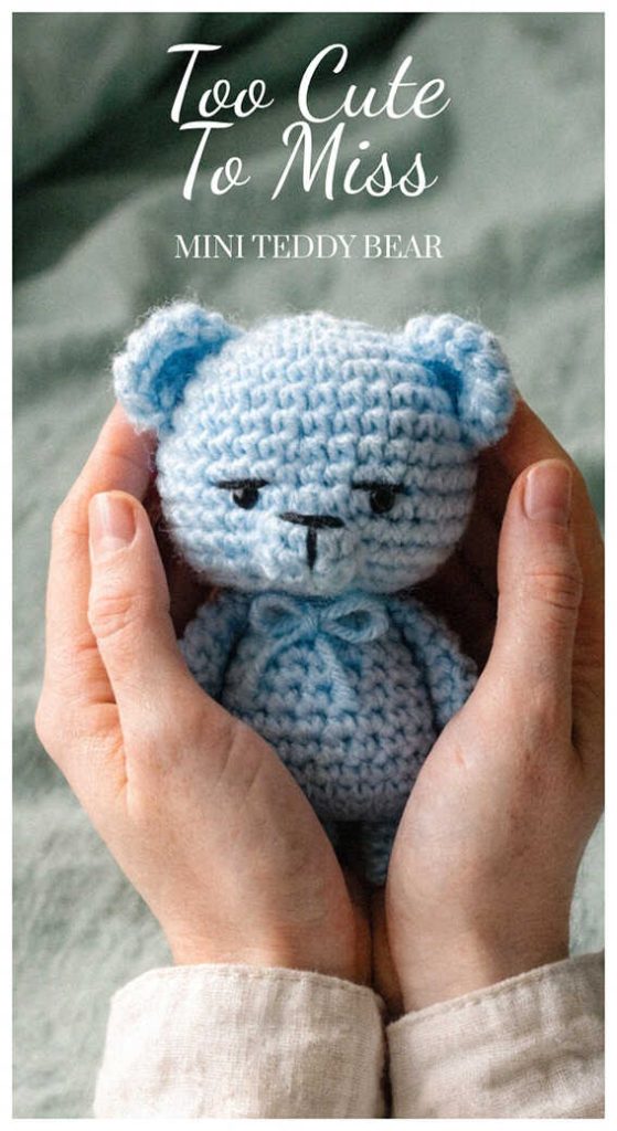 small crochet blue teddy bear amigurumi in hands cute handmade bear toy cozy look
