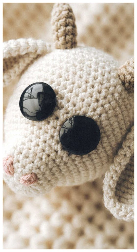 cute goat amigurumi close up handmade crochet plush farm animal inspiration with soft texture detail